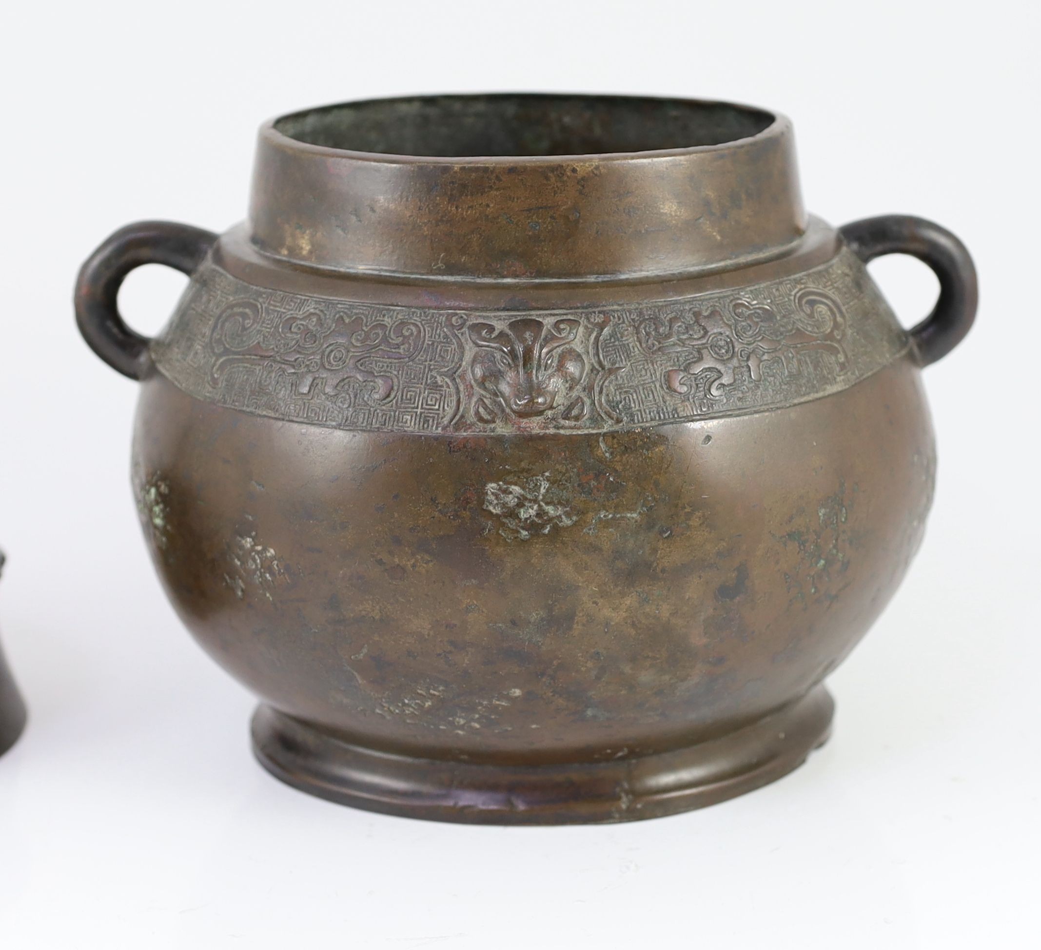 A Chinese Ming bronze jar and cover, hu, 26cm high, old repairs